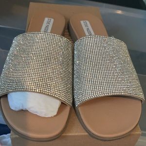 Beautiful bling bling sandals worn once. Size 10 in women.